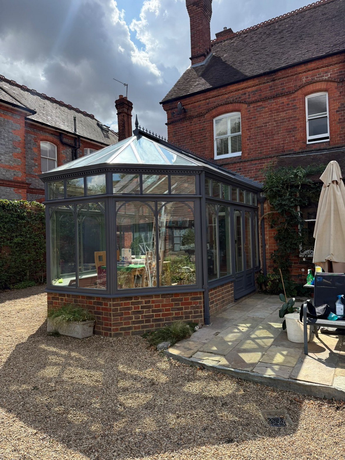 Restored conservatory with repainted grey frames